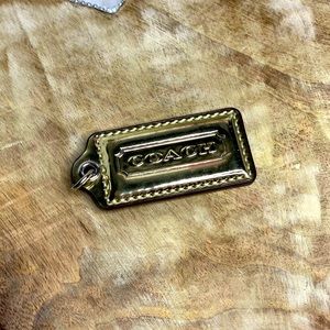 Gold shiney new Coach tag